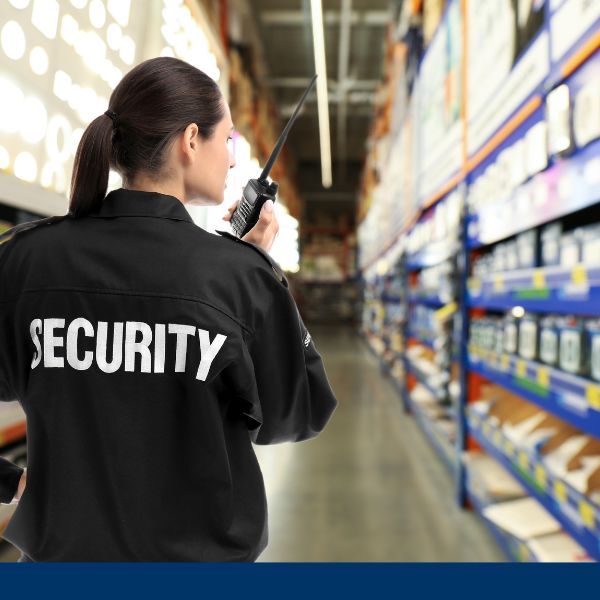 security officer talking into walkie in warehouse