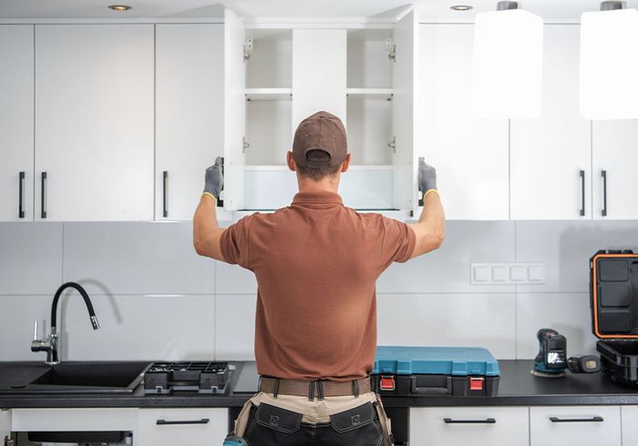 contractor opening cabinets