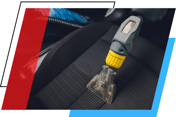 vacuuming a seat in a car 