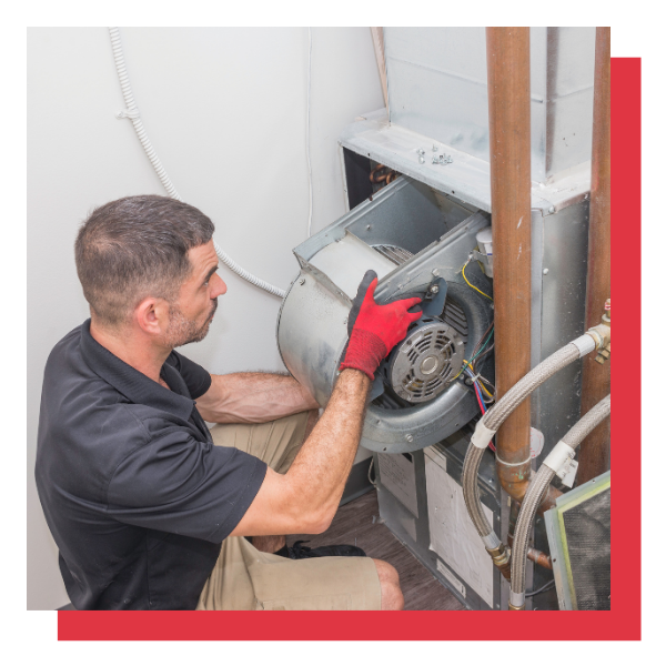 An HVAC tech installing an AC system. An HVAC tech installing an AC system.