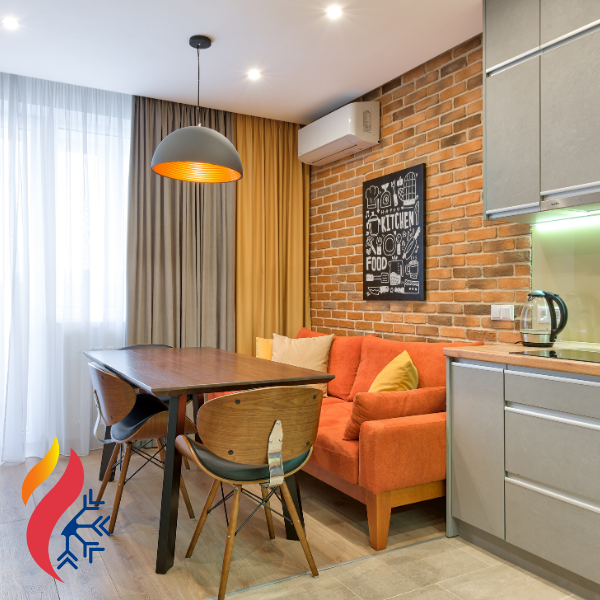 A nice apartment with a brick wall and a mini split AC unit mounted to it