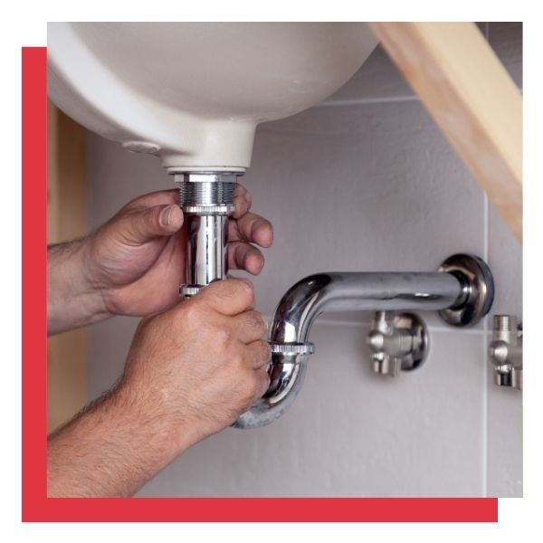 a person changing a sink pipe Content Extension Plumbing Services (2).jpg