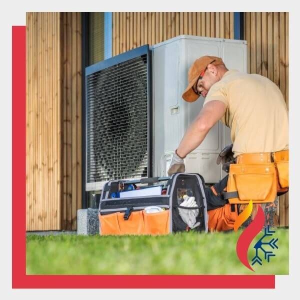 HVAC tech working on a heat pump HVAC tech working on a heat pump