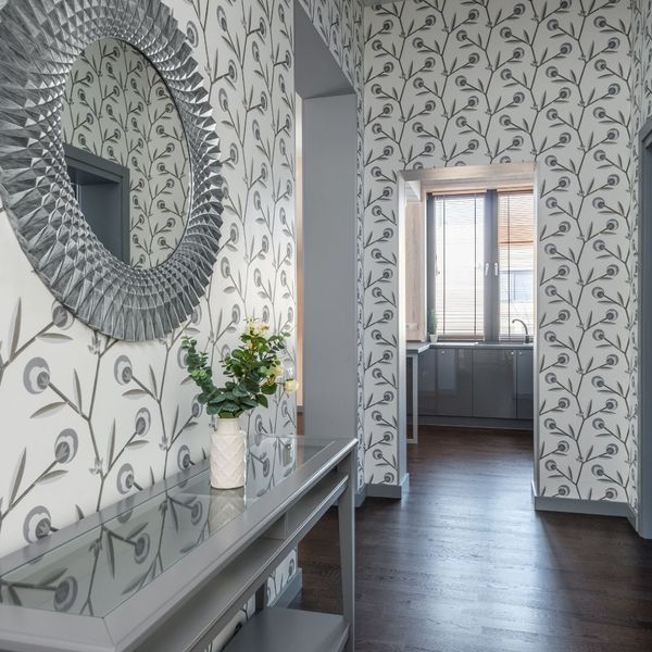 Home hallway with bold yet minimalist wallpaper pattern