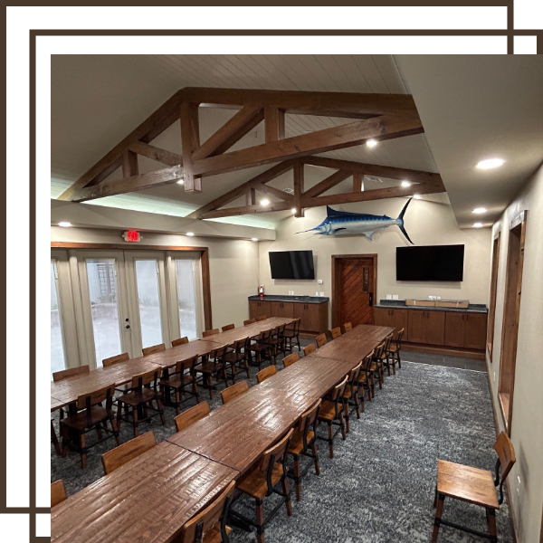 interior of a commercial meeting room with two long tables interior of a commercial meeting room with two long tables