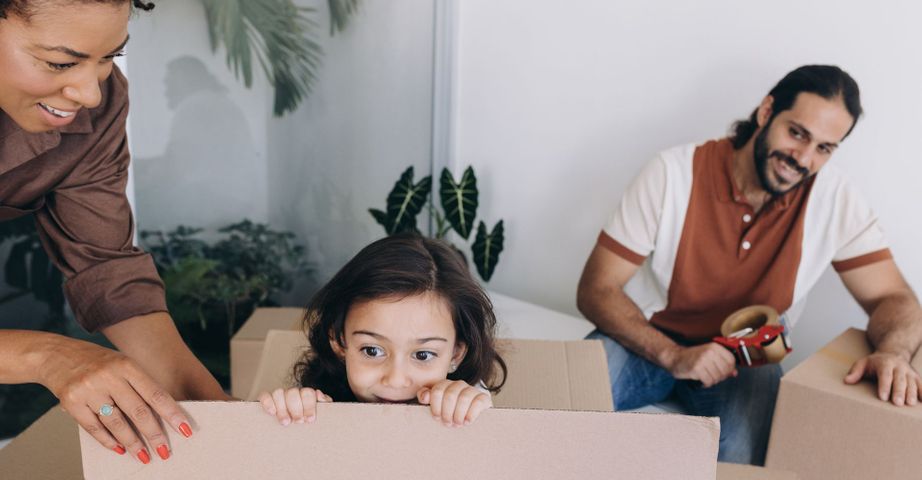family unpacking boxes