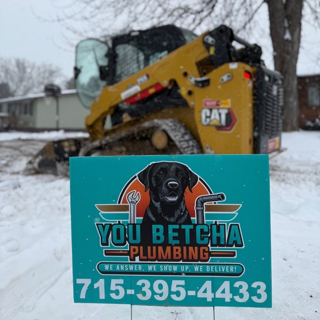 General PlumbingYou betcha plumbing sign with bobcat in background You betcha plumbing sign with bobcat in background