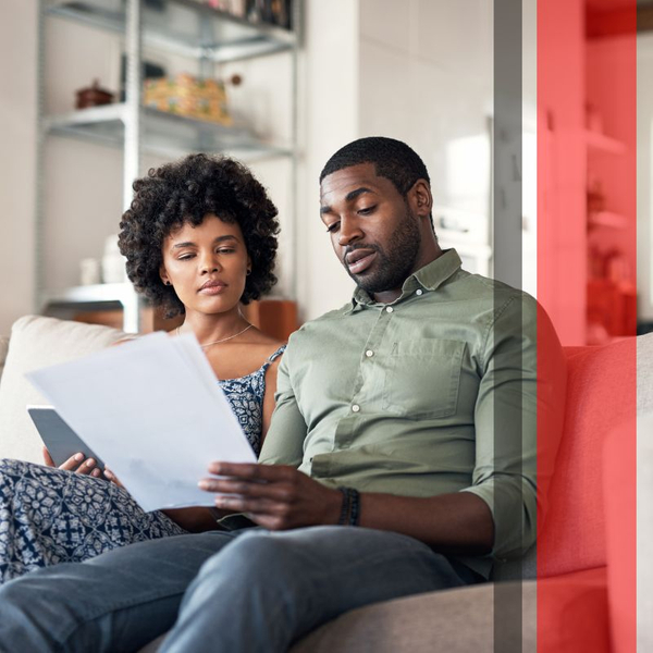 couple at home looking over paperwork