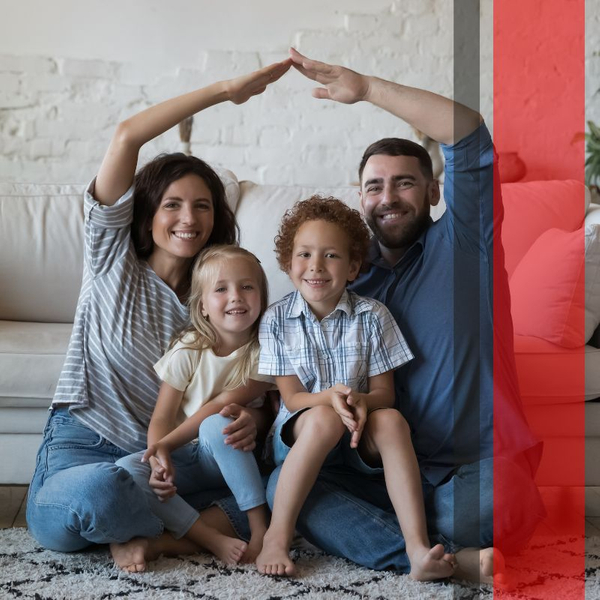 smiling family with the parents making a roof with their arms