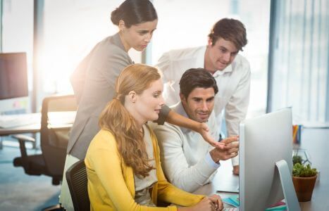 coworkers on computer