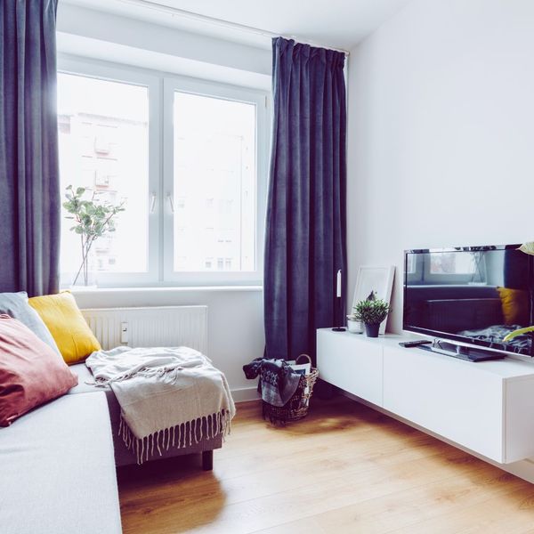 TV and couch in white living room