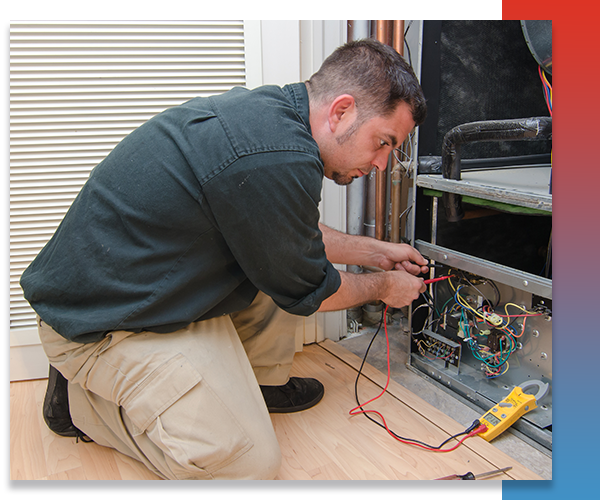 technician repairing heating system