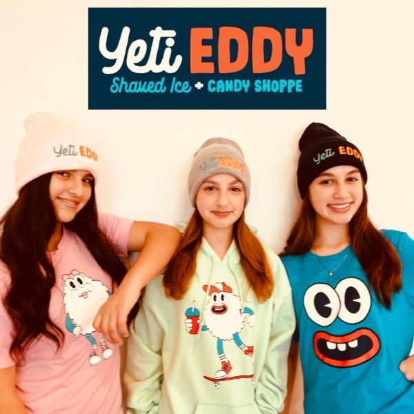 Three girls wearing Yeti Eddy merchandise