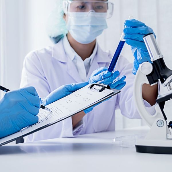 colleagues in a lab discuss a safety checklist colleagues in a lab discuss a safety checklist
