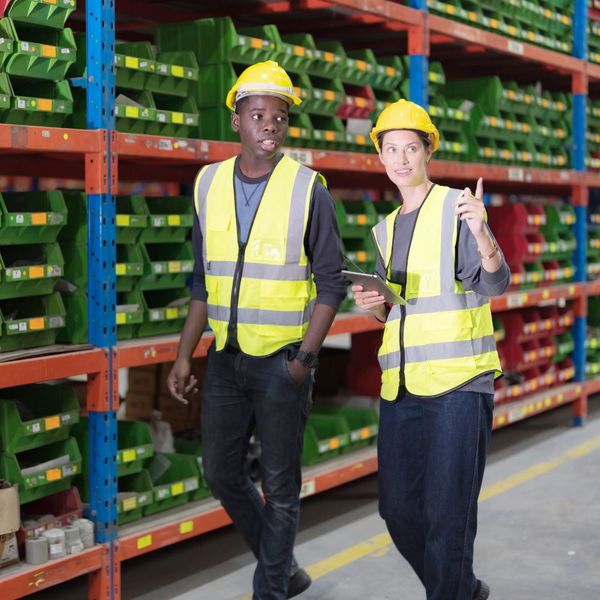 warehouse workers with hard hats warehouse workers with hard hats
