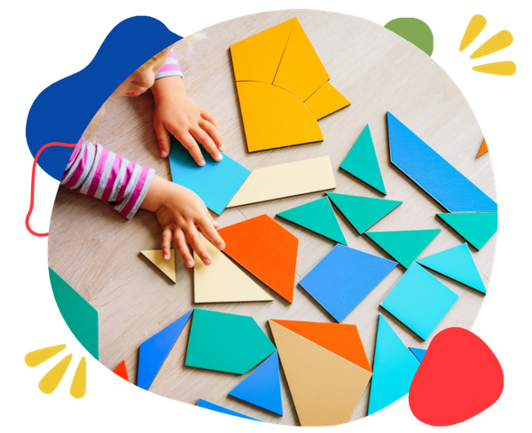 closeup image of a kid playing with tangrams