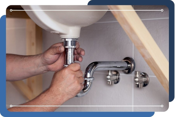 Plumber repairing a pipe