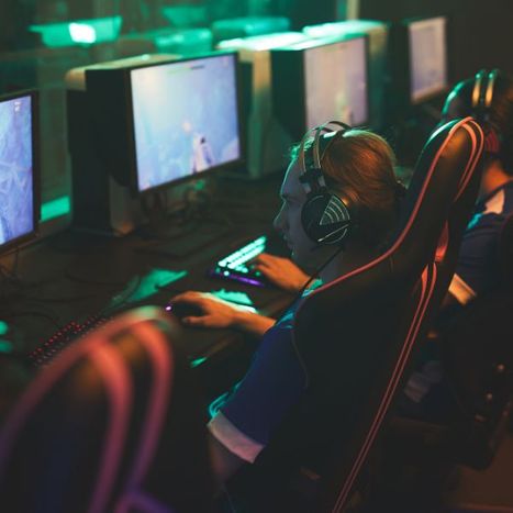 person sitting with other people on computer