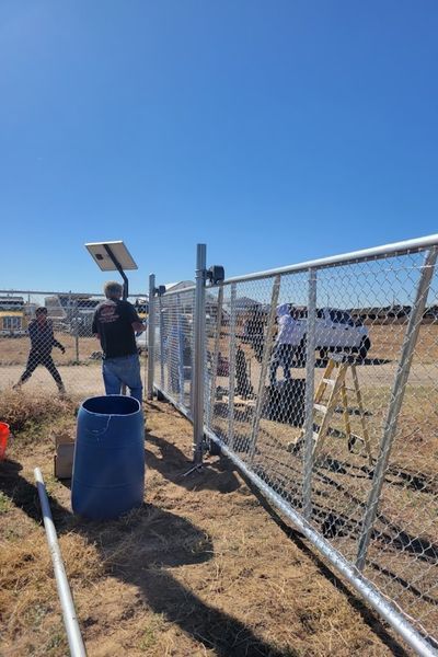 chain link fence and gate boulder