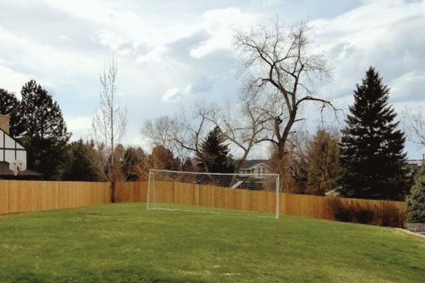 custom build cedar fence around soccer field