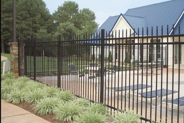 commercial metal fence surrounding a pool