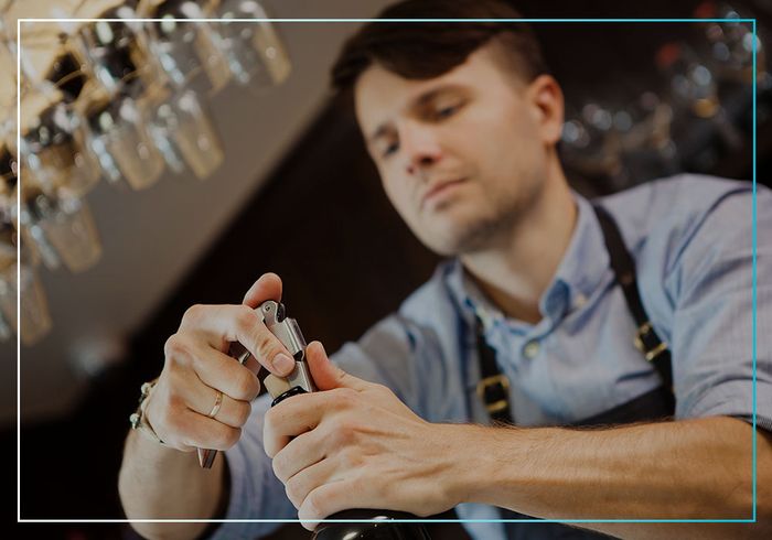 bartender popping cork