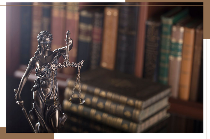 image of lady justice and legal books
