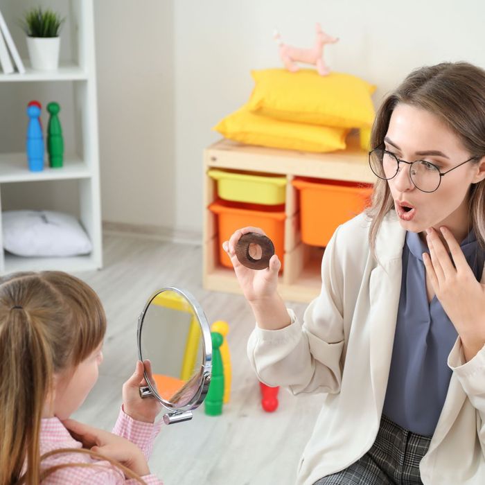 speech therapist working with child