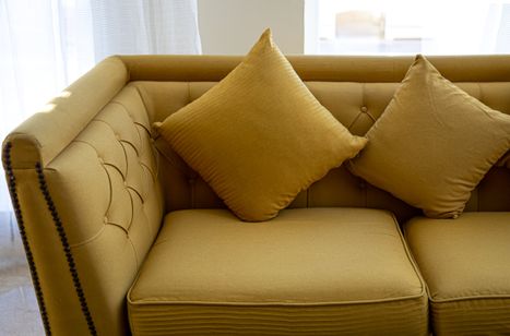 close-up-of-a-large-comfortable-sofa-with-mustard-2022-02-07-11-34-23-utc_orig.jpg