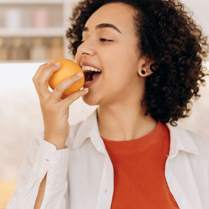 woman eating fruit