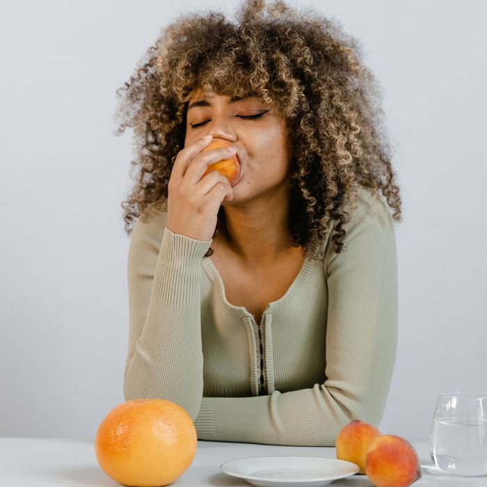 woman eating fruit