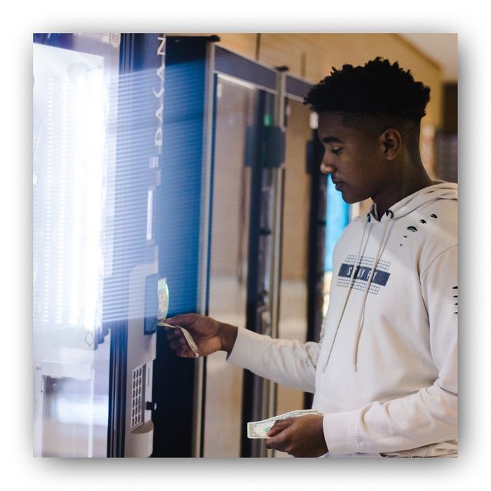 Man paying at a vending machine