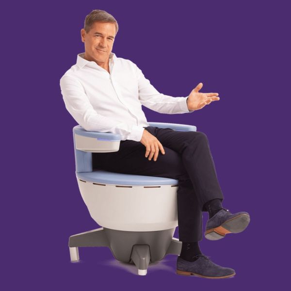 man sitting in emsella chair