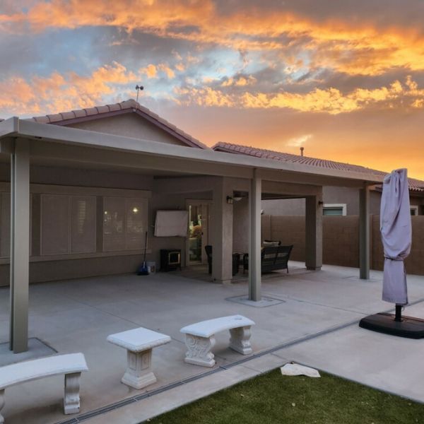 large patio at sunset with outdoor entertainment area