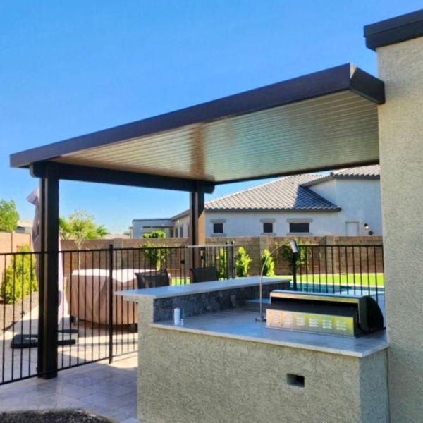 solid patio cover over outdoor kitchen 