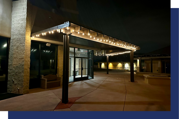 commercial pergola lit up at night