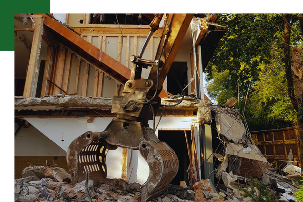 heavy machinery tearing down a building Demo 1.png
