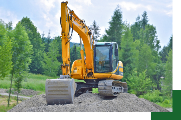 excavator on pile of gravel 