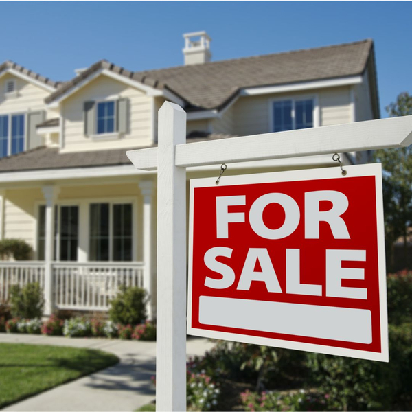 house with a for sale sign