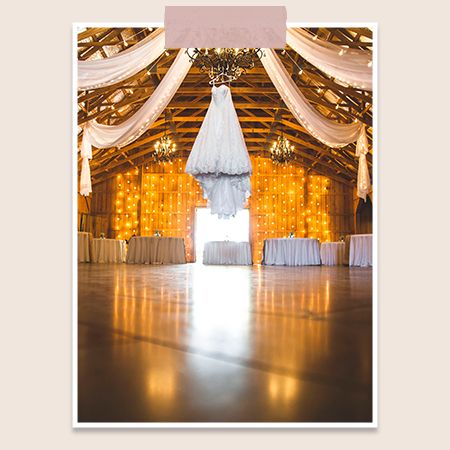 ceiling drapes with a wedding dress in a barn venue
