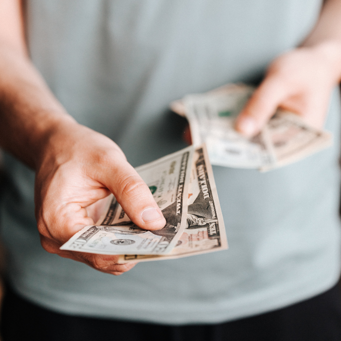 person holding cash