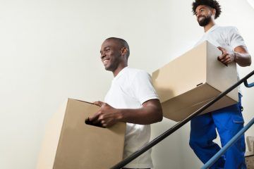 Movers Carrying Boxes
