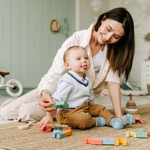 A mother palying with her child.