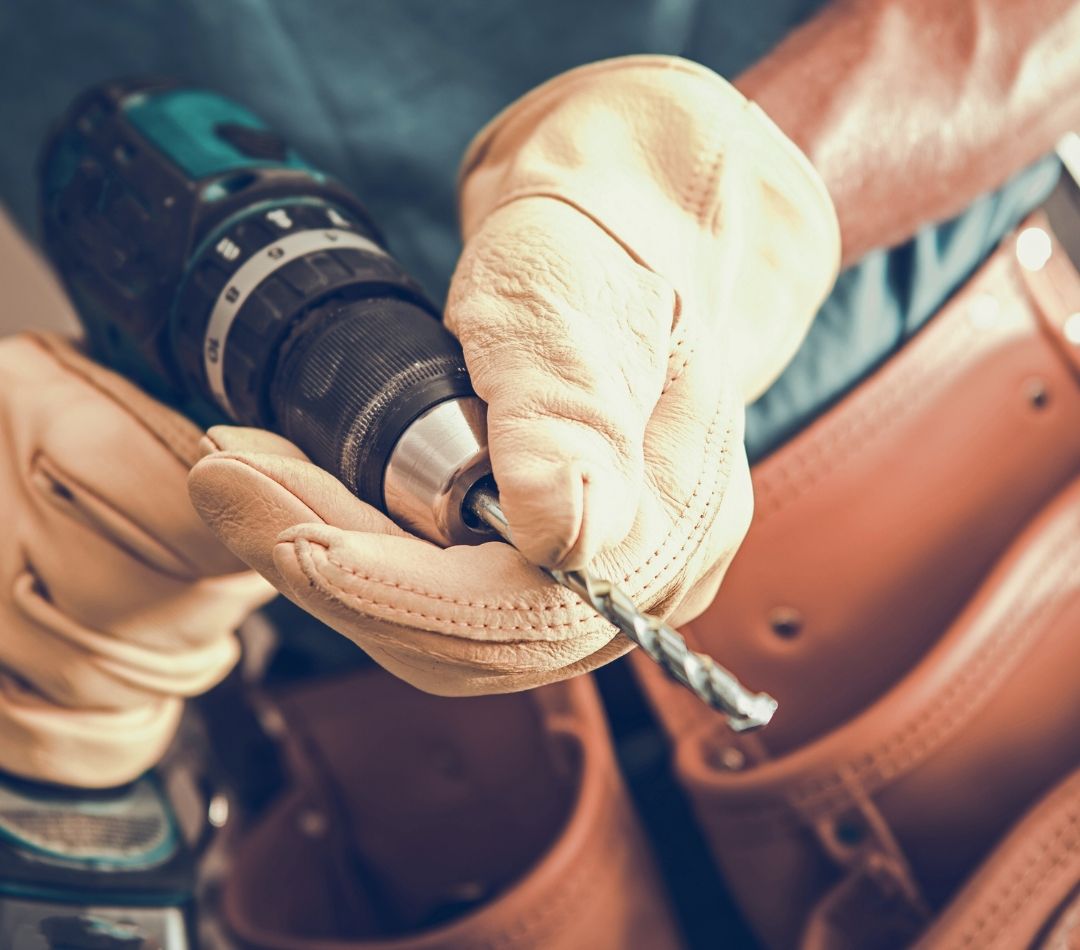 person using a drill person using a drill