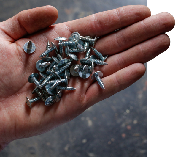 person holding screws