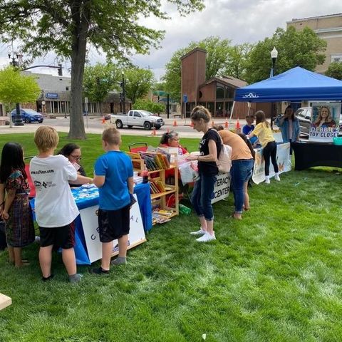 children working with community members