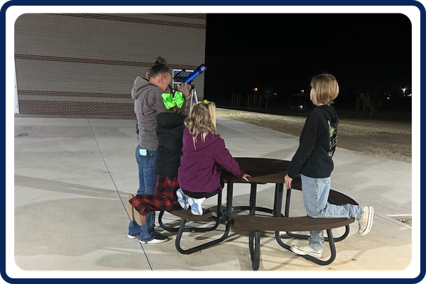 students outside doing an activity