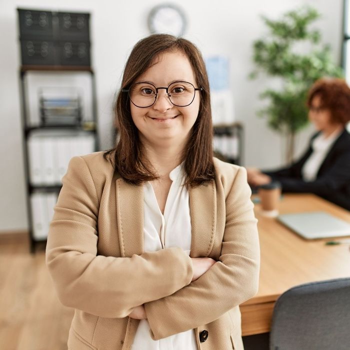 young professional woman with down syndrome at office job