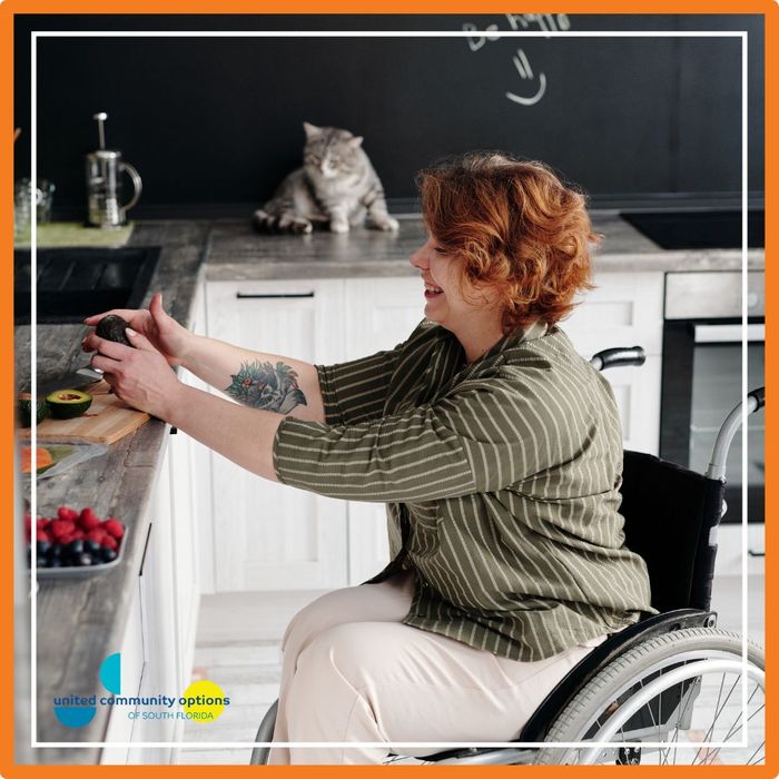 a woman cutting an avocado How Supported Living Enhances Independence (2).jpg