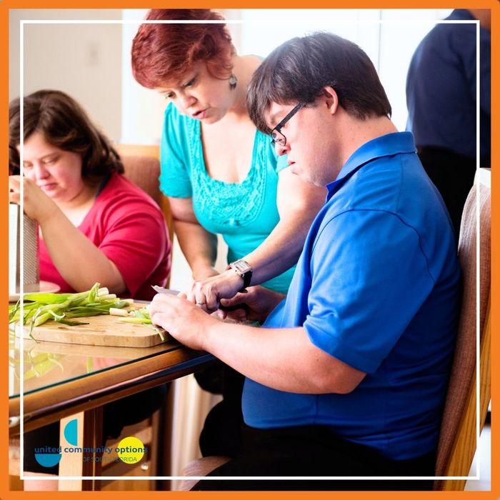 Adults preparing food together